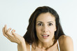 Woman making surprised face, holding up hand, portrait