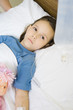 Girl lying in hospital bed