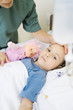 Girl lying in hospital bed