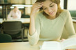 Young woman studying in university library