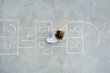 Photo : Little girl playing hopscotch, overhead view Little girl playing hopscotch, overhead view