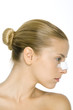 Woman with bandage on nose, profile