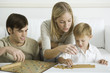 Family playing board game together