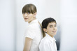 Mother and son back to back, portrait