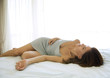 Woman sleeping on bed