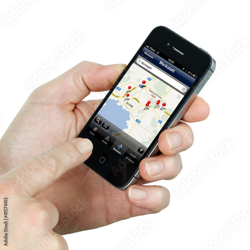 Illustration: Smart phone holding in a hand to find the way Smart phone holding in a hand to find the way