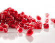 Ripe pomegranate seeds on white Ripe pomegranate seeds on white