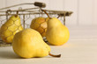 Fresh ripe pears in basket on table Fresh ripe pears in basket on table