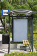 Bus stop with the ad behind the glass
