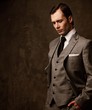 Man in grey suit.
