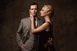 Retro couple on grey background.