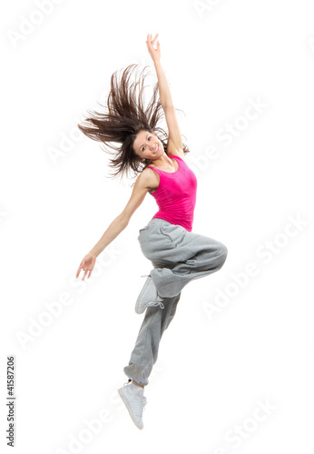 Photo: Modern teenage girl dancer dancing hip-hop and jumping Modern teenage girl dancer dancing hip-hop and jumping