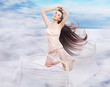 Long haired brunette in a dreamy scenery Long haired brunette in a dreamy scenery