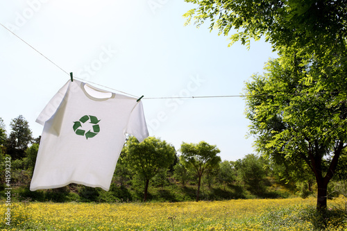 Photo: T-shirt with recycle logo drying on clothesline T-shirt with recycle logo drying on clothesline
