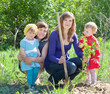 women and  baby girls planting raspberry