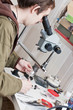 Male jeweller is working