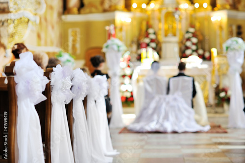 Photo: Beautiful flower wedding decoration in a church Beautiful flower wedding decoration in a church