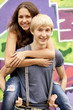 Style teen couple near graffiti background. Style teen couple near graffiti background.
