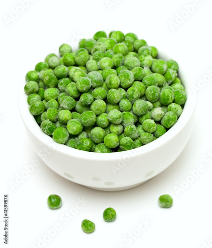 Photo: frozen peas isolated on white background frozen peas isolated on white background