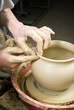 hands of a potter, creating an earthen jar on the circle hands of a potter, creating an earthen jar on the circle