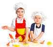 Two beautiful caucasian brothers making a cake