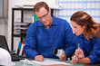 Worker and intern checking stock levels