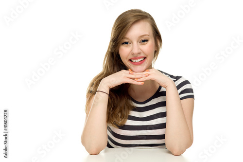 Photo: Woman resting her arms on table Woman resting her arms on table