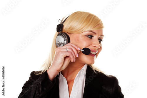 Foto: Smiling woman using headphones and mike Smiling woman using headphones and mike