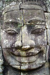 Stone head on towers of Bayon temple in Angkor Thom, Cambodia Stone head on towers of Bayon temple in Angkor Thom, Cambodia