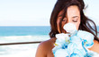 cute young bride smelling bouquet