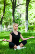 Beautiful teenage girl making exercises in the park in spring Beautiful teenage girl making exercises in the park in spring
