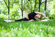 Beautiful teenage girl making exercises in the park in spring Beautiful teenage girl making exercises in the park in spring