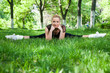 Beautiful teenage girl making exercises in the park in spring Beautiful teenage girl making exercises in the park in spring