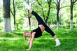 Beautiful teenage girl making exercises in the park in spring Beautiful teenage girl making exercises in the park in spring