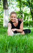 Beautiful teenage girl making exercises in the park in spring Beautiful teenage girl making exercises in the park in spring
