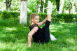 Beautiful teenage girl making exercises in the park in spring Beautiful teenage girl making exercises in the park in spring