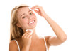 Woman removing makeup with cleansing pads