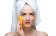 Young woman cleaning her face Young woman cleaning her face