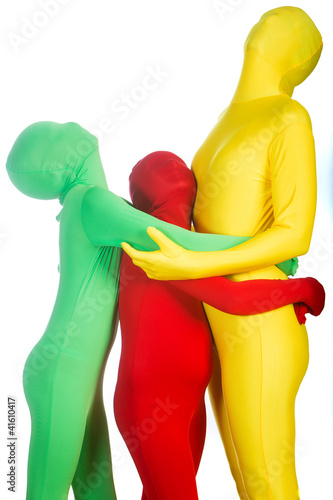 Foto: Three Colorful People looking up Three Colorful People looking up