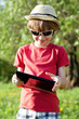 Joyful boy plays in the Tablet PC