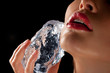 Sensual woman with ice cube.