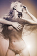Attractive fashion model with long blond hair.