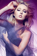 Attractive fashion model with long blond hair.