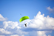 Skydiver with a green parachute