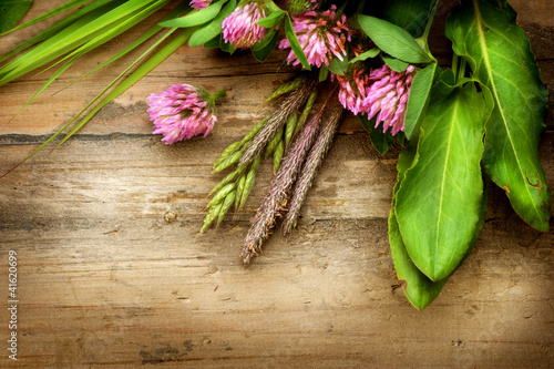 Photo: Herbs over Wood. Herbal Medicine. Herbal Background Herbs over Wood. Herbal Medicine. Herbal Background