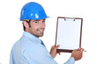 Architect holding clip-board and pen