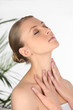 Woman rubbing her own neck