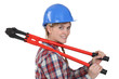 Tradeswoman holding large clippers