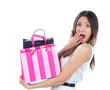young woman with shopping bags after successful shoppingand look