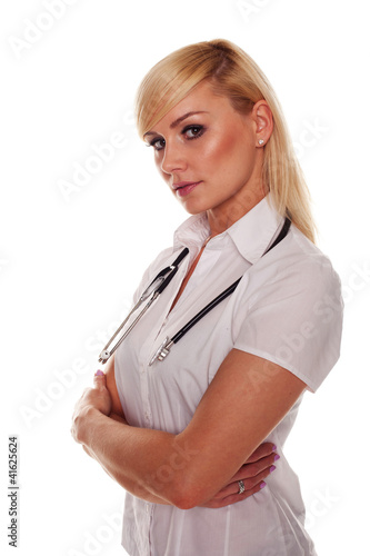 Photo: Young blonde attractive doctor with arms crossed Young blonde attractive doctor with arms crossed